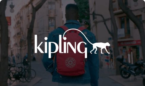 Kipling logo on image of man wearing backpack